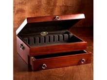 Simple, yet elegant, this stunning Silver Chest will protect your silver for generations to come. Crafted by the artisans of Reed & Barton, this spacious chest holds 130 pieces, including spreaders. The lid's interior features a racking system for knives and serving pieces. Chest measures 15-3/4x11-3/4x3-1/2 and is fully lined with tarnish-preventative silver cloth. Detailed with solid brass inplates. Made in USA. Simple, yet elegant, this stunning Silver Chest will protect your silver for generations to come. Crafted by the artisans of Reed & Barton, this spacious chest holds 130 pieces, including spreaders. The lid's interior features a racking system for knives and serving pieces. Chest measures 15-3/4x11-3/4x3-1/2 and is fully lined with tarnish-preventative silver cloth. Detailed with solid brass inplates. Made in USA.