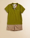 A classic, cotton knit with short sleeves and a check-lined button placket for your little man.Polo collarShort sleevesFront button placketSide vented hemCottonMachine washImported Please note: number of buttons may vary depending on size ordered. 