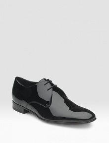 Lace-up design is expertly crafted in Italian patent leather. Leather lining and sole Padded insole Made in Italy