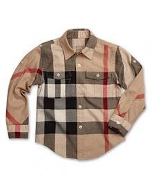Oversized Burberry check on a timeless button-up silhouette for big Brit style. Oversized Burberry check on a timeless button-up silhouette for big Brit style.