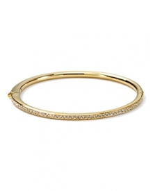 The slender bangle from Nadri is crafted in polished 18 Kt. gold plate with a single-row of gleaming crystal pave to a bring a touch of light.