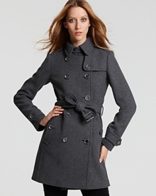 Show off iconic style in this chic Burberry Brit trench that boasts classic details. Cozy yet sleek, this coat takes you from work to weekend in style.