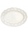 Handcrafted in the Italian tradition, the Merletto oval platter is intricately embellished with a lacy floral texture and painted a creamy antique white. An elegant companion to Arte Italica dinnerware.