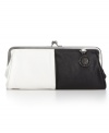 A classy takes on the of-the-moment colorblock trend. A two-tone design with shiny gunmetal hardware make this mod-inspired design ideal for a chic night on the town.