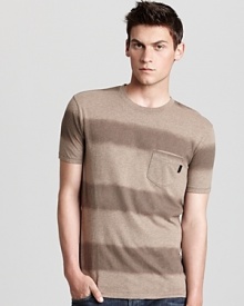 Soft cotton and a classic stripe pattern combine on this casual tee from Burberry Brit. Soft cotton and a classic stripe pattern combine on this casual tee from Burberry Brit.