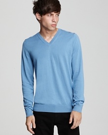 Crafted in luxuriously soft cotton and cashmere, this sleek v-neck sweater is accented with Burberry's signature check print at the shoulder. Crafted in luxuriously soft cotton and cashmere, this sleek v-neck sweater is accented with Burberry's signature check print at the shoulder.