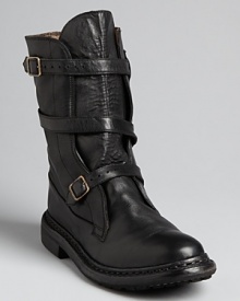 Burberry lends its sophisticated British polish to these moto boots, put together with sleekly styled hardware and straps. Burberry lends its sophisticated British polish to these moto boots, put together with sleekly styled hardware and straps.