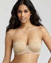 Calvin Klein Underwear seductive comfort lace basic strapless bra. Floral detail at front and side bands. Removable adjustable straps with hook and eye closure. Push up. Smooth contoured shape. Style #U1143