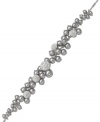 Simply stunning! Swarovski's exquisitely-crafted bracelet features a majestic accumulation of grey crystal pearls. Delicate details in clear crystal Pointiage® add gorgeous sparkle. Crafted in rhodium-plated mixed metal. Approximate length: 6-1/2 inches.