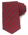 A traditionally striped tie in pure Italian silk lends luxury to your polished wardrobe and can be worn to work or your dressed-up evening affairs.