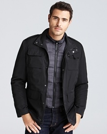 This rugged field jacket sports six front pockets for convenient on the go storage, adding the zip out vest that can be worn alone or in tandem with the jacket for extra protection from the cold. This rugged field jacket sports six front pockets for convenient on the go storage, adding the zip out vest that can be worn alone or in tandem with the jacket for extra protection from the cold.