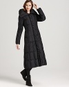 Brave the coldest of days in the coziest of style with this down-filled maxi coat from Cole Haan.