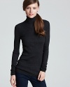 Flaunt your contours in this curve-skimming Vince ribbed sweater and add a soft touch to your favorite skinnies.