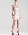 Shimmering sequins take on a geometric form on BCBGMAXAZRIA's standout cap sleeve shift dress.