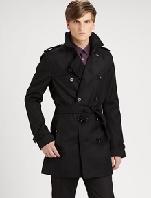 The classic double-beasted trench in a sleek, rain-resistant poly-cotton blend.Notch collarEpaulettesStorm flapsDouble-breasted button frontBuckle-strap cuffsSelf-beltButton welt pocketsBack shoulder ventInverted back pleat below waistAbout 33 from shoulder to hem65% polyester/35% cottonFully linedDry cleanImported The classic double-beasted trench in a sleek, rain-resistant poly-cotton blend.Notch collarEpaulettesStorm flapsDouble-breasted button frontBuckle-strap cuffsSelf-beltButton welt pocketsBack shoulder ventInverted back pleat below waistAbout 33 from shoulder to hem65% polyester/35% cottonFully linedDry cleanImported