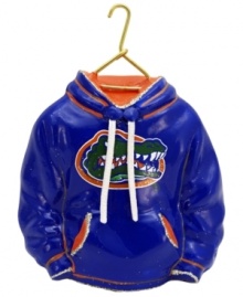 Fitting for Florida alum, this hand-painted hoodie ornament trims the tree in Gators orange and blue. Glitter amps up the school and holiday spirit. Fitting for Florida alum, this hand-painted hoodie ornament trims the tree in Gators orange and blue. Glitter amps up the school and holiday spirit.