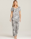 A playful pajama set with a floral print short sleeve top and matching capri pants.