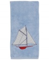 Set sail for uncharted bath decor with this nautical-themed hand towel from Creative Bath. Emblazoned with a seafaring schooner, this plush towel docks beautifully-powder rooms to bathrooms.