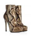 Finish your look on a luxurious note with Le Sillas ultra glamorous python ankle boots, detailed in chic natural coloring perfect for pairing with statement daytime separates - Softly pointed toe, hidden platform, inside zip, dagger heel, leather and rubber sole - Wear with sleek leggings and chunky knit tops, or with form-fitting sheaths and a dusting of sparkly jewelry