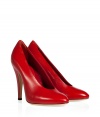 With disco-ready seventies styling, these classic red leather pumps from Casadei add an instant kick to any outfit - Rounded toe, high cut front, stiletto heel - Pair with a figure-hugging cocktail sheath, skinny jeans, or a pencil skirt