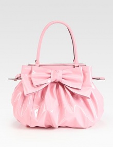 Lustrous patent leather in a roomy carryall, topped with a chic oversized bow.Double top handles, 7 dropTop zip closureOne inside zip pocketTwo inside open pocketsCotton lining14W X 13½H X 4DMade in Italy Lustrous patent leather in a roomy carryall, topped with a chic oversized bow.Double top handles, 7 dropTop zip closureOne inside zip pocketTwo inside open pocketsCotton lining14W X 13½H X 4DMade in Italy