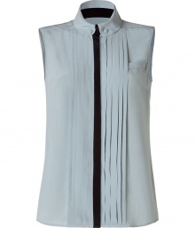 Elegant top made ​.​.of fine, ice blue silk - Mega stylish with a stand-up collar, pleated draping and accent stitching - The cut is feminine fitted and slim - Slightly longer cut, sleeveless - A great fashion upgrade for simple basics - Chic under a pants suit, rocking with leather pants, casual with jeans