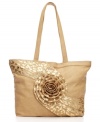 Be noticed: this boldly chic purse showcases a plushly petaled handwoven rose rising in a swirling burst and ramps up the drama with a goldtone leopard print.