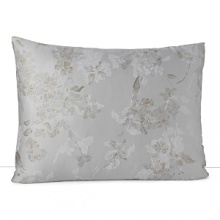 A soft floral in muted blue and taupe is scattered across a silvery grey background in this collection from Calvin Klein Home. A soft floral in muted blue and taupe is scattered across a silvery grey background in this collection from Calvin Klein Home.