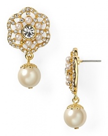 Carolee crafts a feminine statement with this pair of delicate pearl and crystal drop earrings, accented by elegant gold-plated floral detailing. Carolee crafts a feminine statement with this pair of delicate pearl and crystal drop earrings, accented by elegant gold-plated floral detailing.