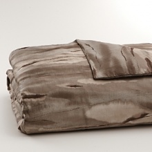 Inspired by the wild game of Africa, but reinterpreted in a watercolor abstracted way in bronze, taupe and earth colors on sateen. Duvet has hidden button closure. Duvets, shams and comforters are self-reversing. Inspired by the wild game of Africa, but reinterpreted in a watercolor abstracted way in bronze, taupe and earth colors on sateen. Duvet has hidden button closure. Duvets, shams and comforters are self-reversing.