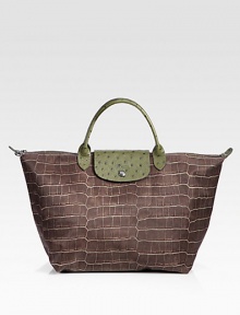 An updated design in an exotic-inspired print on nylon with ostrich-embossed leather trim.Double leather handles, 4½ dropTop zip and snap flap closureOne inside open pocketPVC backing11¾W X 11H X 8DImported An updated design in an exotic-inspired print on nylon with ostrich-embossed leather trim.Double leather handles, 4½ dropTop zip and snap flap closureOne inside open pocketPVC backing11¾W X 11H X 8DImported