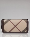 This Burberry wallet keeps the essentials in check, classically styled in coated canvas with a well-organized interior and plenty of pockets.