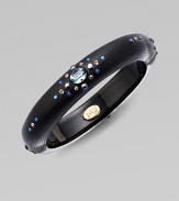This hand-crafted piece is adorned with Swarovski crystals and imitation pearls. Lucite Hinged, magnetic closure Diameter, about 2½ Width, about ½ Made in USA 