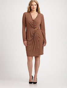 A signature Michael Michael Kors design featuring a simply stylish print. You will love how its feminine neckline, draped center and hint of stretch flatter your shape.V-necklineLong sleevesLogo detail at draped centerAllover printAbout 25 from natural waistPolyester/spandexMachine washImported