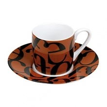 Whimsical drinkware to add fun and color to the table. Konitz mugs feature the highest quality color and glaze. A collage of black, jumbled letters on a brown ground. Whimsical drinkware to add fun and color to the table. Konitz mugs feature the highest quality color and glaze. A collage of black, jumbled letters on a brown ground.
