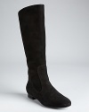 Suede lends a luxe touch and dressed-up wardrobe possibilities to flat riding boots; from Via Spiga.