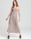 A strapless Design History maxi dress lends effortless chic to your day, then moves seamlessly into early evening. Embellished at the bust with pleated detail, the look epitomizes easy elegance.