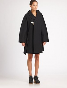 Exposed seam allowances and an exaggerated silhouette create an effect that's both dramatic and minimal.Notched lapelsContrast front tieConcealed back zipAbout 39 from shoulder to hemPolyesterDry cleanImportedModel shown is 5'10 (177cm) wearing US size Small. Exposed seam allowances and an exaggerated silhouette create an effect that's both dramatic and minimal.Notched lapelsContrast front tieConcealed back zipAbout 39 from shoulder to hemPolyesterDry cleanImportedModel shown is 5'10 (177cm) wearing US size Small.