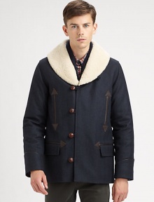 A winter classic topped with a shearling collar, toggle button-front and front pockets with exquisite leather trim.Button-frontChest welt, waist flap pocketsRear ventFully linedAbout 30 from shoulder to hemWoolDry cleanImportedFur origin: Portugal