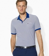 Perform your best in this moisture-wicking stretch jersey polo, crafted with stylish stripes and a chest pocket for easy scorecard storage.