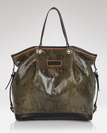 Embrace reptile style with this embossed leather tote from Longchamp, which features a glossy snakeskin motif and deceptively roomy exterior for a look that's poisonously practical. Embrace reptile style with this embossed leather tote from Longchamp, which features a glossy snakeskin motif and deceptively roomy exterior for a look that's poisonously practical.