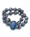 Dynamically designed. With its majestic medallion embellishment, Carolee's double-row bracelet will add a dramatic detail to your wardrobe. Crafted in hematite tone mixed metal, it's adorned with glass accents. A stretch design lets it slip on and off with grace and ease. Approximate diameter: 2-1/4 inches