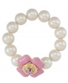 Petite and precocious, this feminine style by Carolee highlights a pretty pink enamel flower and glass accent with a white glass pearl (14 mm) stretch design. Set in gold tone mixed metal. Approximate diameter: 2-1/4 inches.