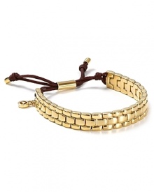 This Michael Kors watch band takes its cues from the jewel box, crafted of gold-tone plate with an adjustable bar closure.