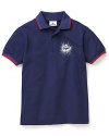 Lacoste's classic polo gets an eye-catching update with striped edges and a bright starburst crocodile logo.