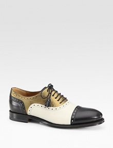 Oxford-inspired leather with metallic leather trim and tassel laces. Stacked heel, 1 (25mm)Nappa leather and metallic leather upperLeather lining and solePadded insoleMade in ItalyOUR FIT MODEL RECOMMENDS ordering one half size down as this style runs large. 