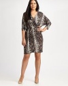 A sexy python print meets a flattering v-neckline giving this faux-wrap dress an exceptional look that you will love to wear.V-neckThree-quarter sleevesFaux wrap frontLeather waist detailAllover printAbout 23 from natural waist94% polyester/6% spandexMachine washImported