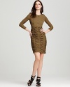 In a military-inspired khaki hue, the Burberry Nilly dress gets a textural treatment with dramatic ruching.