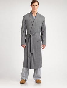Luxurious, knit robe is incredibly smooth and soft for endless hours of comfort.Shawl collarTie waistFront patch pockets53% polyamide/47% viscoseMachine washImported