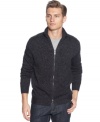 Easily polish up your t-shirt and jeans look with this solid full zip cardigan by Calvin Klein.